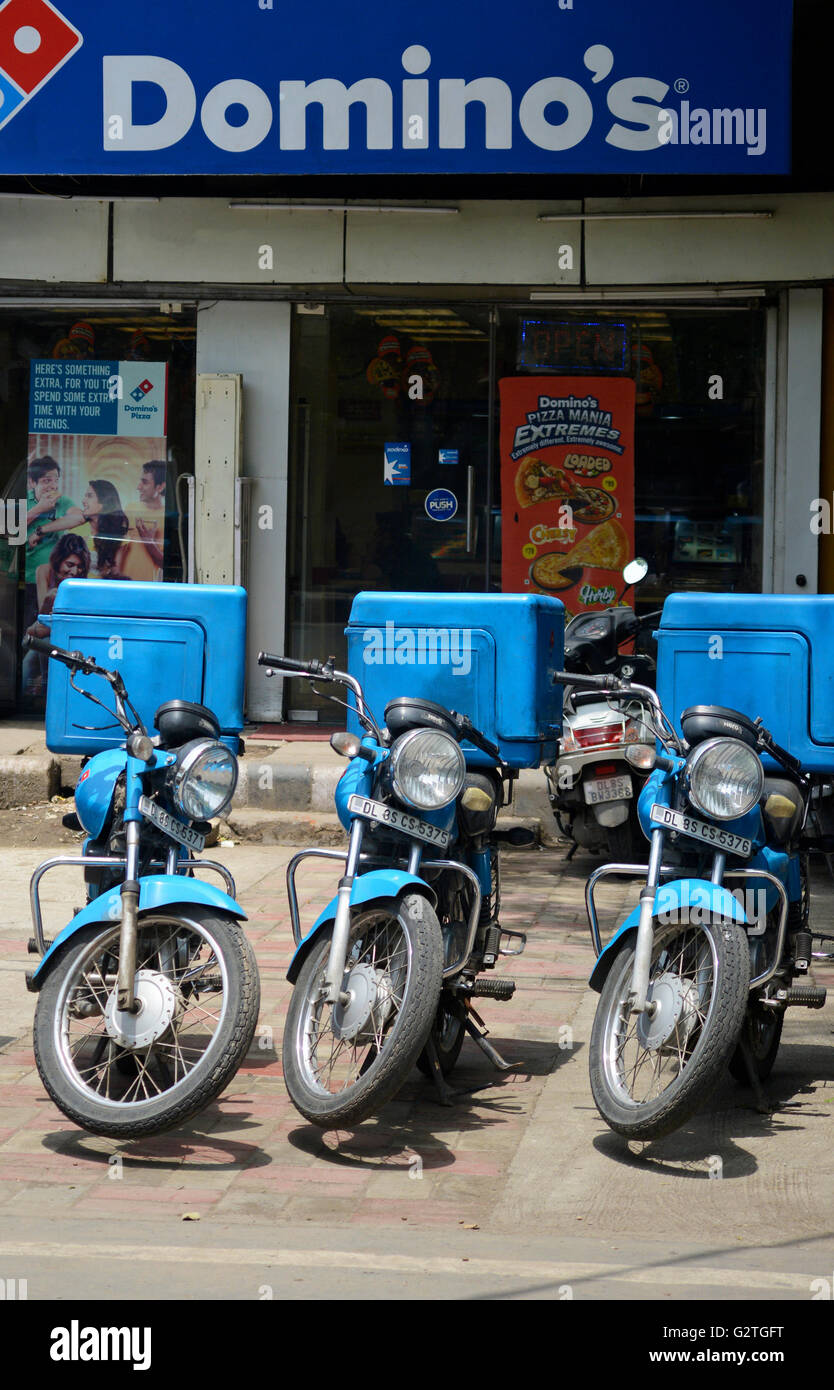 Domino's Restaurant and Delivery bike in a row,India Stock Photo