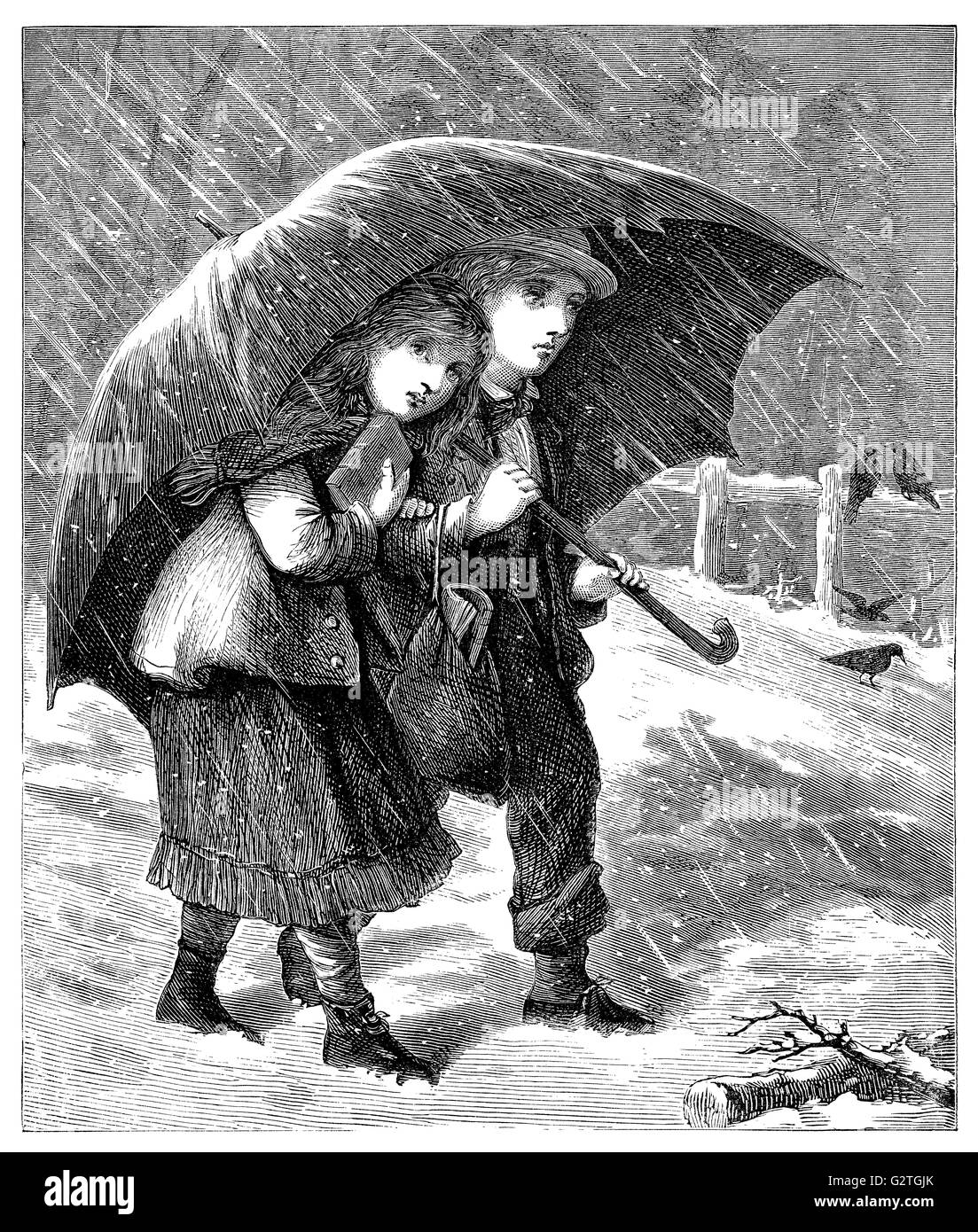 Black and white engraving of a Victorian boy and girl in the snow under an umbrella. Stock Photo
