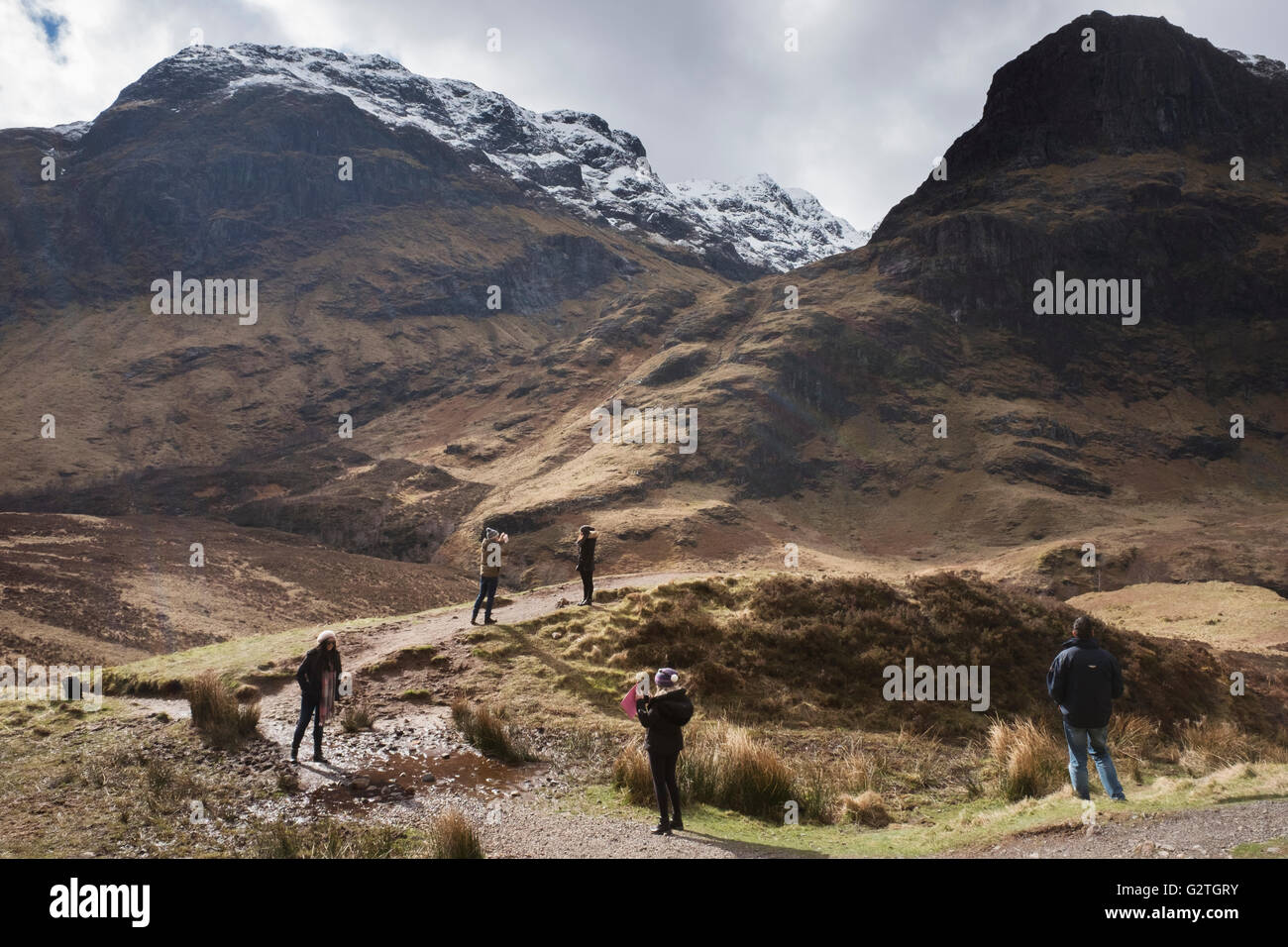 Tourists in Glencoe, Scotland, UK Stock Photo