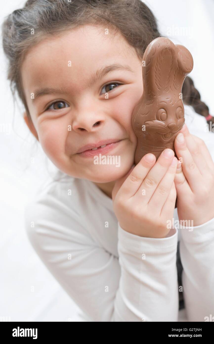 Girl with a chocolate Easter Bunny Stock Photo