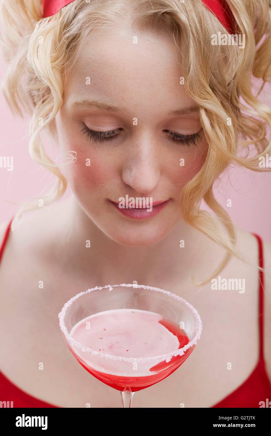 Young woman with Cosmopolitan Stock Photo