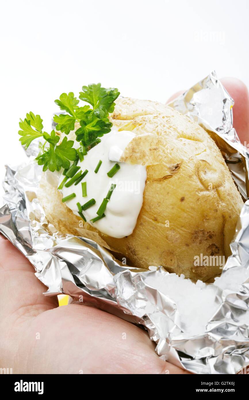 Baked potato with herb quark Stock Photo Alamy
