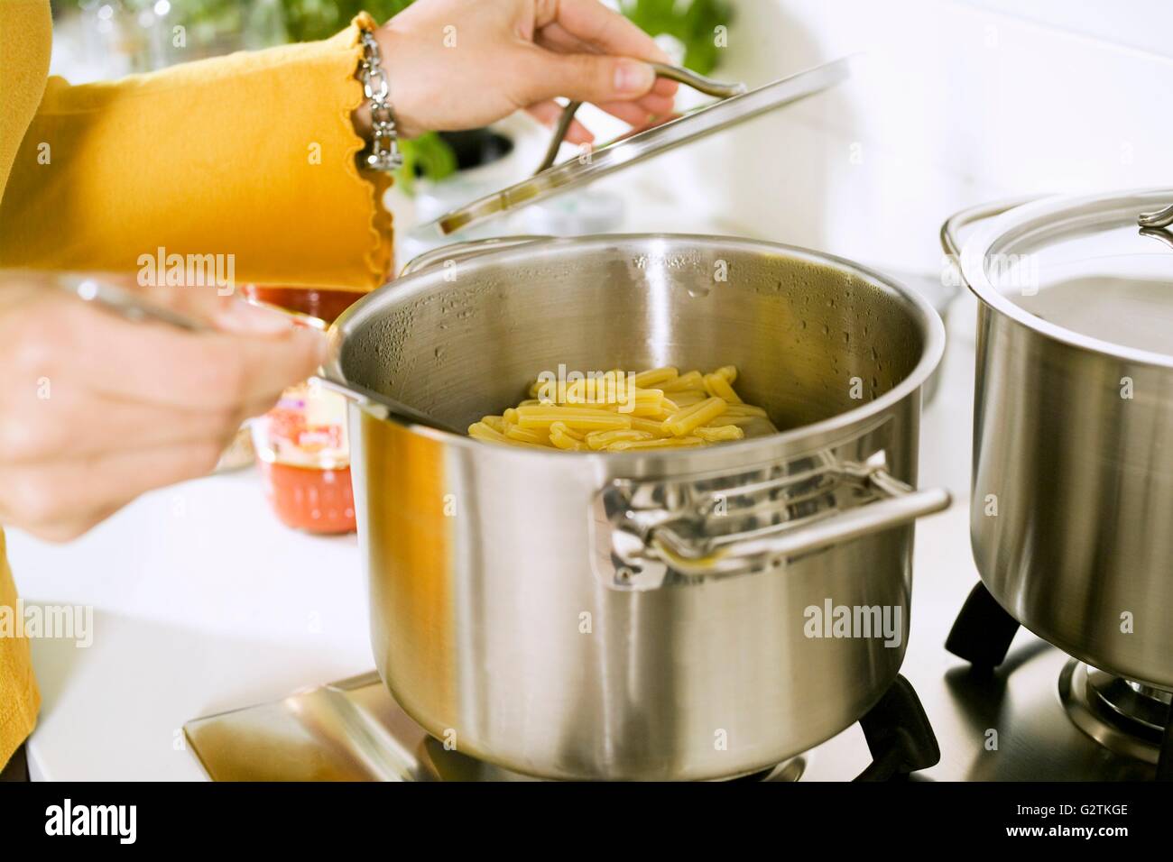 Cooking pasta in salted water Stock Photo