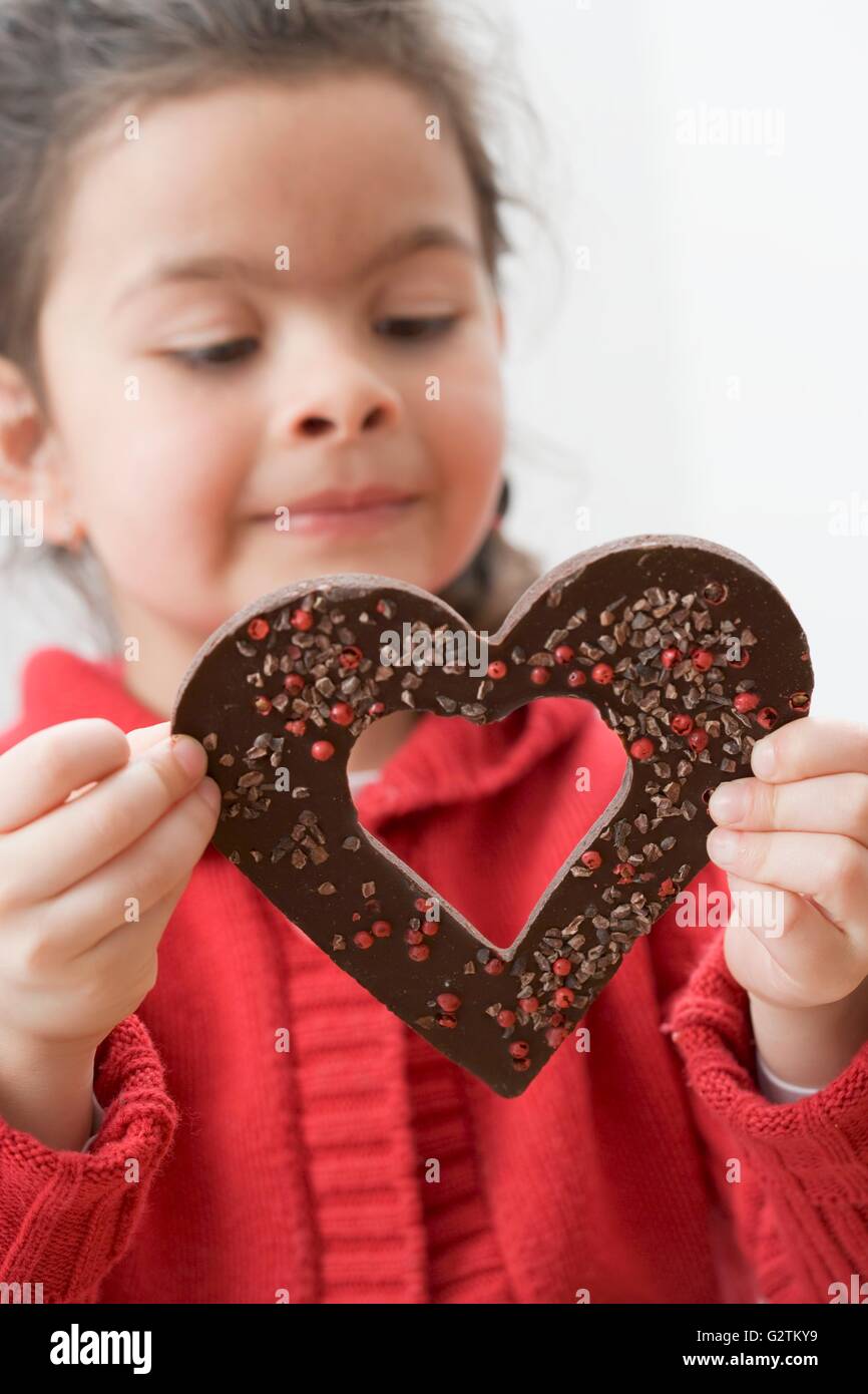 Girl with a chocolate heart Stock Photo - Alamy