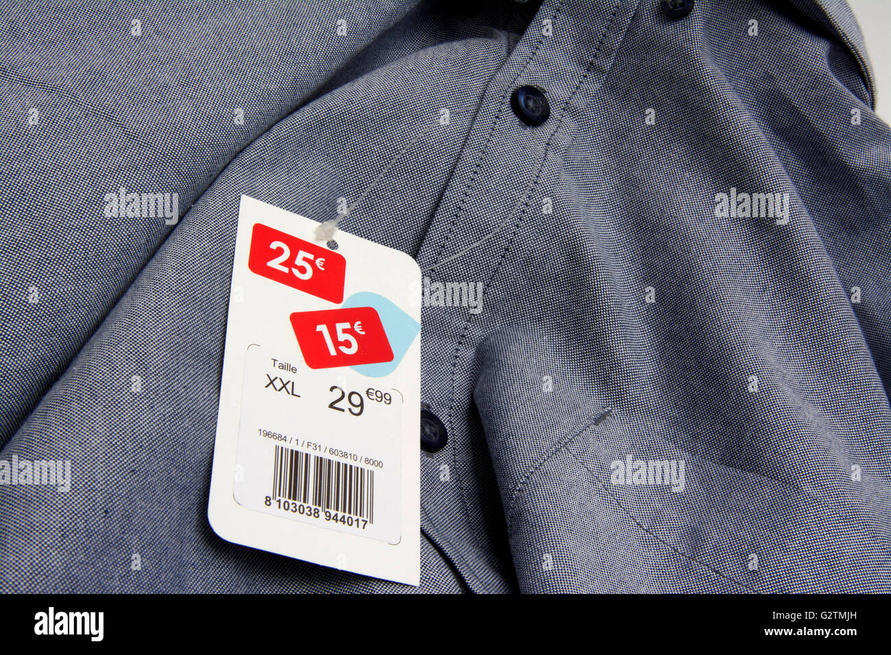 Clothing in the sales, reduced price tag in Euro Stock Photo - Alamy