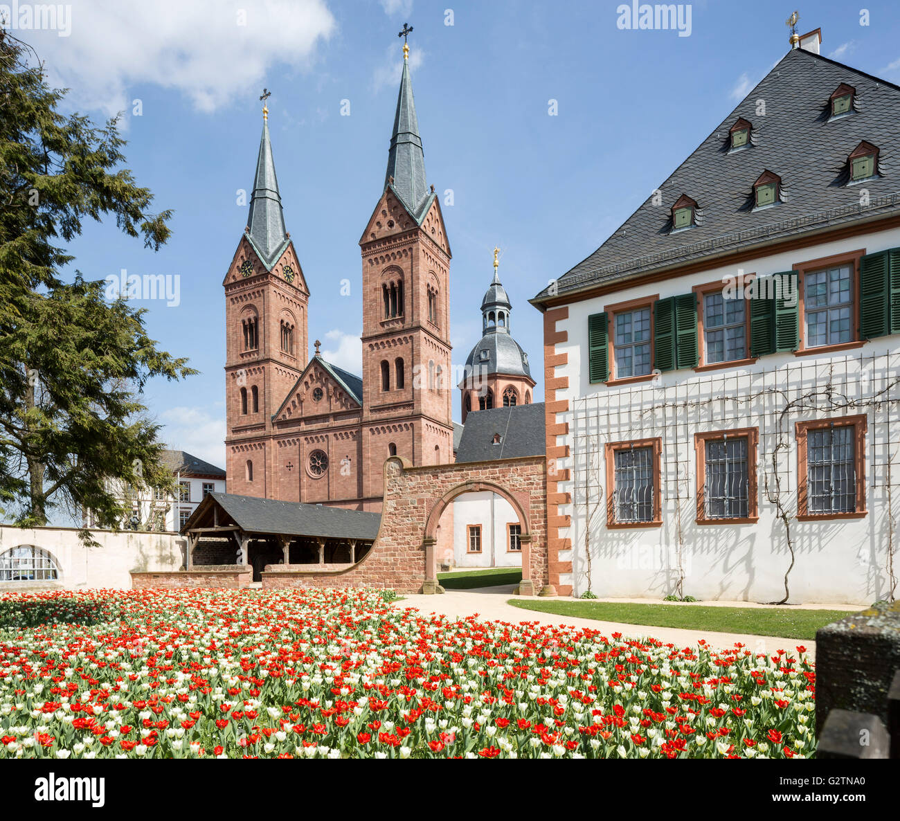 Former Benedictine Abbey with monastery garden and abbey church, Einhard Basilica or Church of St. Marcellinus and Petrus Stock Photo