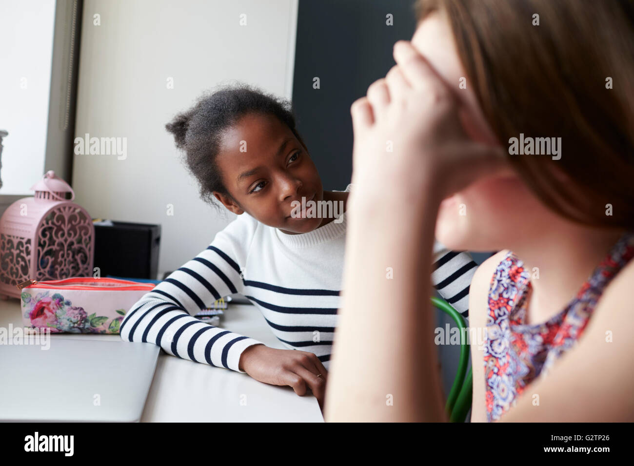 Teenage Girl Comforting Friend Suffering With Depression Stock Photo