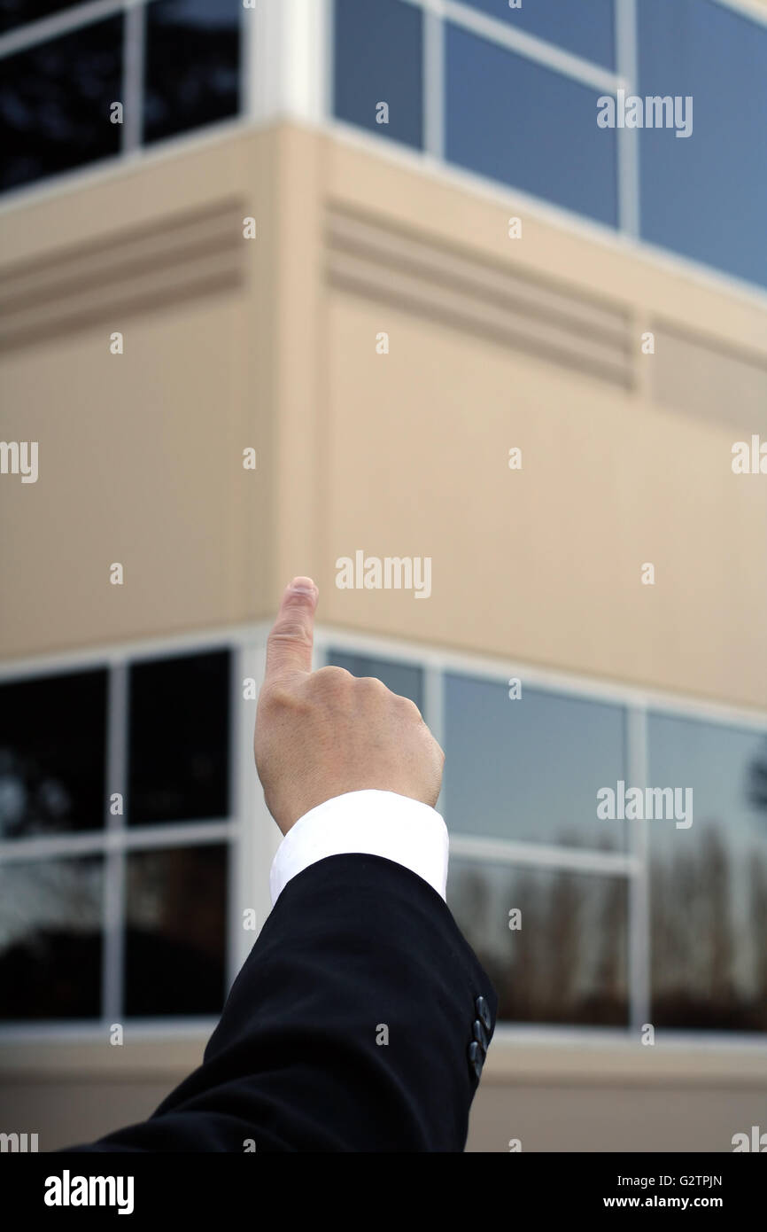 Point At Building Businessman pointing to a building Stock Photo - Alamy