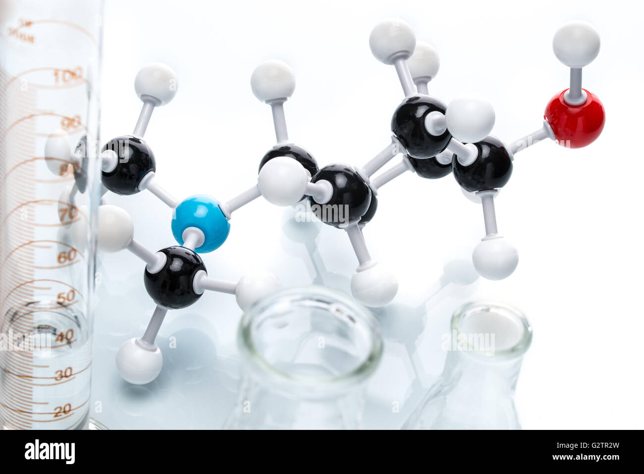 Molecular Structure and measuring bottle on white background Stock