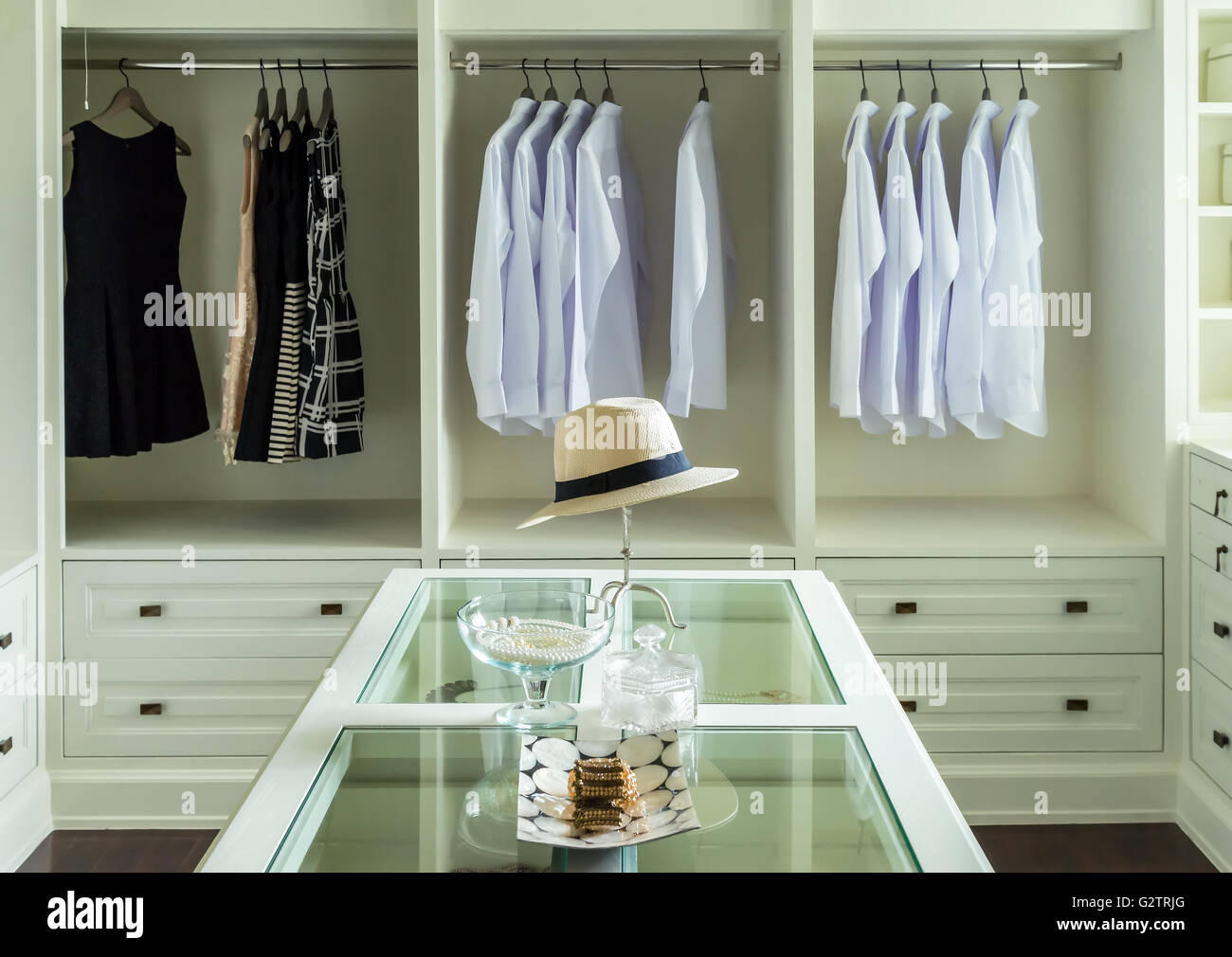 White Hat And Jewelry Set On A Dresser Table In A Walk In Closet