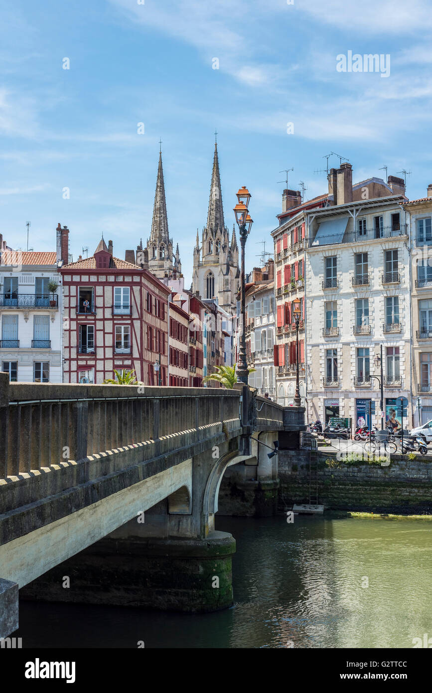 Pont Marengo bridge over Le Nive river with the Cathedral of Sainte-Marie de Bayonne, in background. Aquitaine, France. Stock Photo
