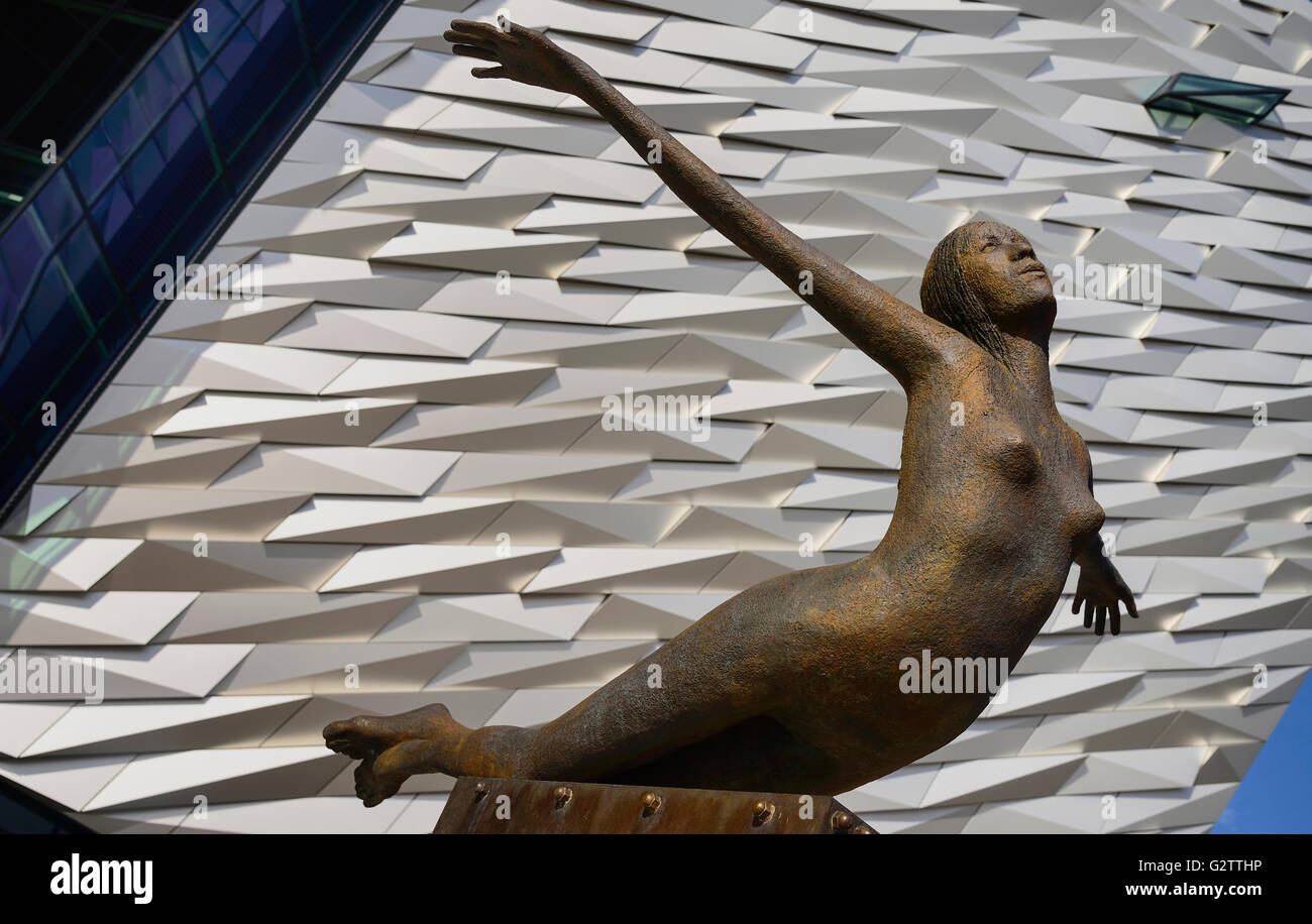 Ireland, Belfast, Titanic Quarter, Titanic Belfast Visitor Experience, 'Titanica' sculpture by Rowan Gillespie with section of the building in the background. Stock Photo