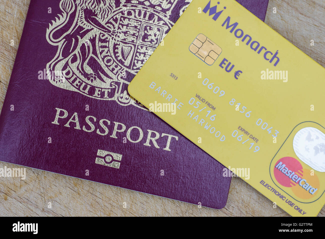 Close up of a Monarch Airlines prepaid Euro Mastercard with a UK passport Stock Photo