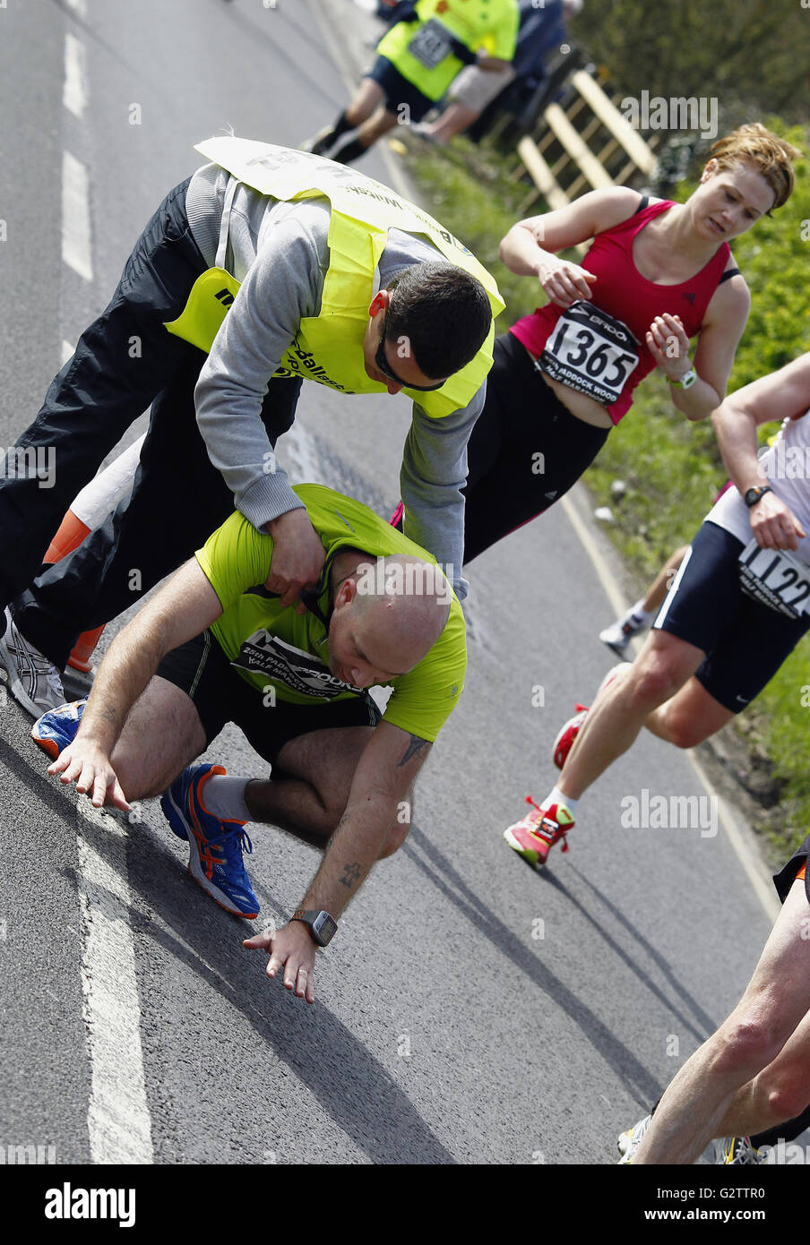 Sport, Athletics, Running, Exhausted runner being helped by marshal