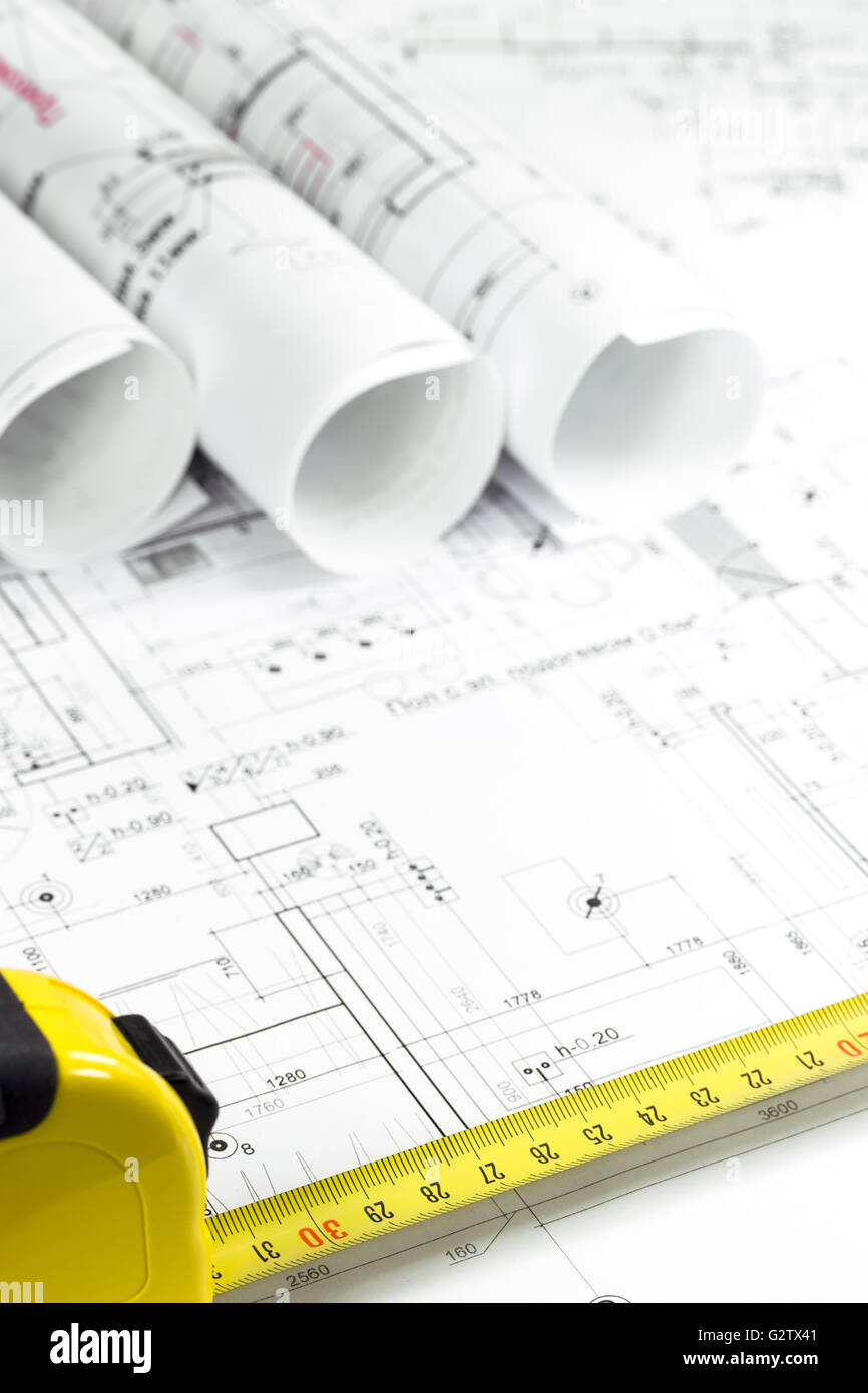 Home building construction plans with yellow measuring tape Stock Photo