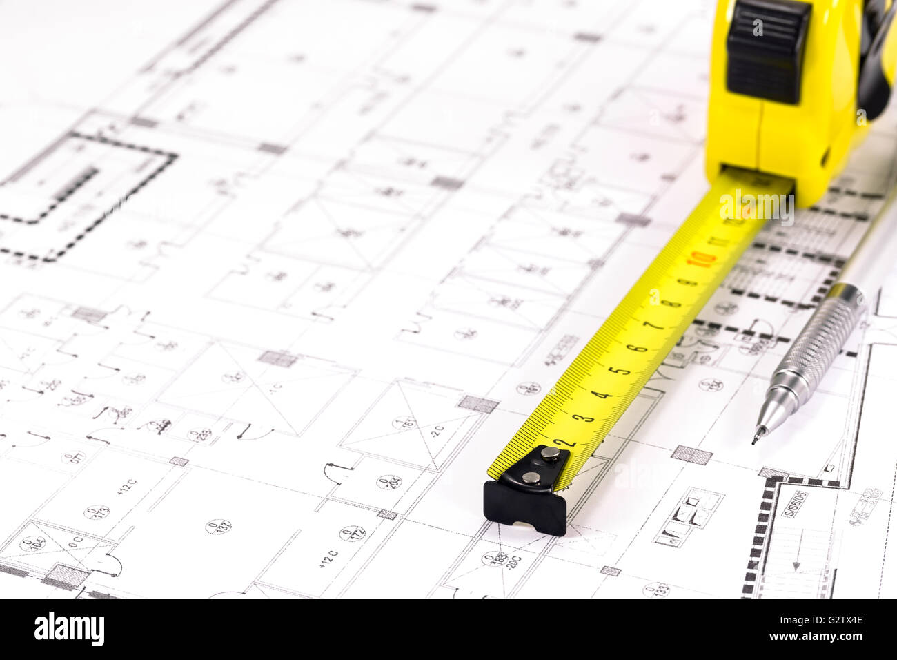 Home blueprint plans and yellow measuring tape Stock Photo Alamy