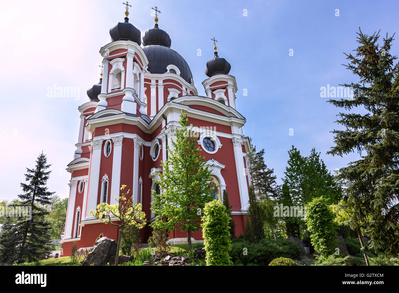 Orthodox Curchi monastery in Moldova with green trees and blue sky ...