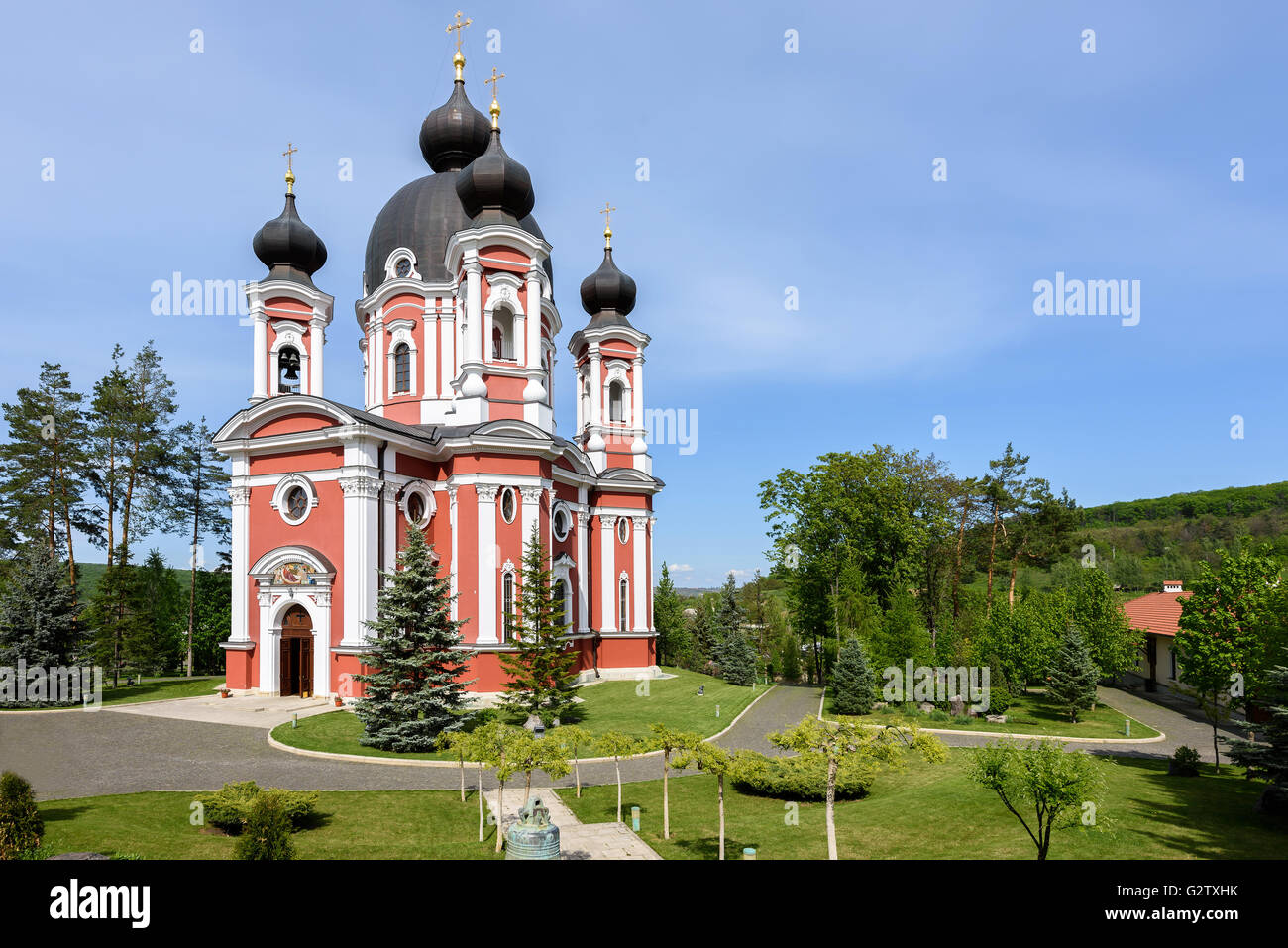 Orthodox Curchi monastery in Moldova with green trees and blue sky ...
