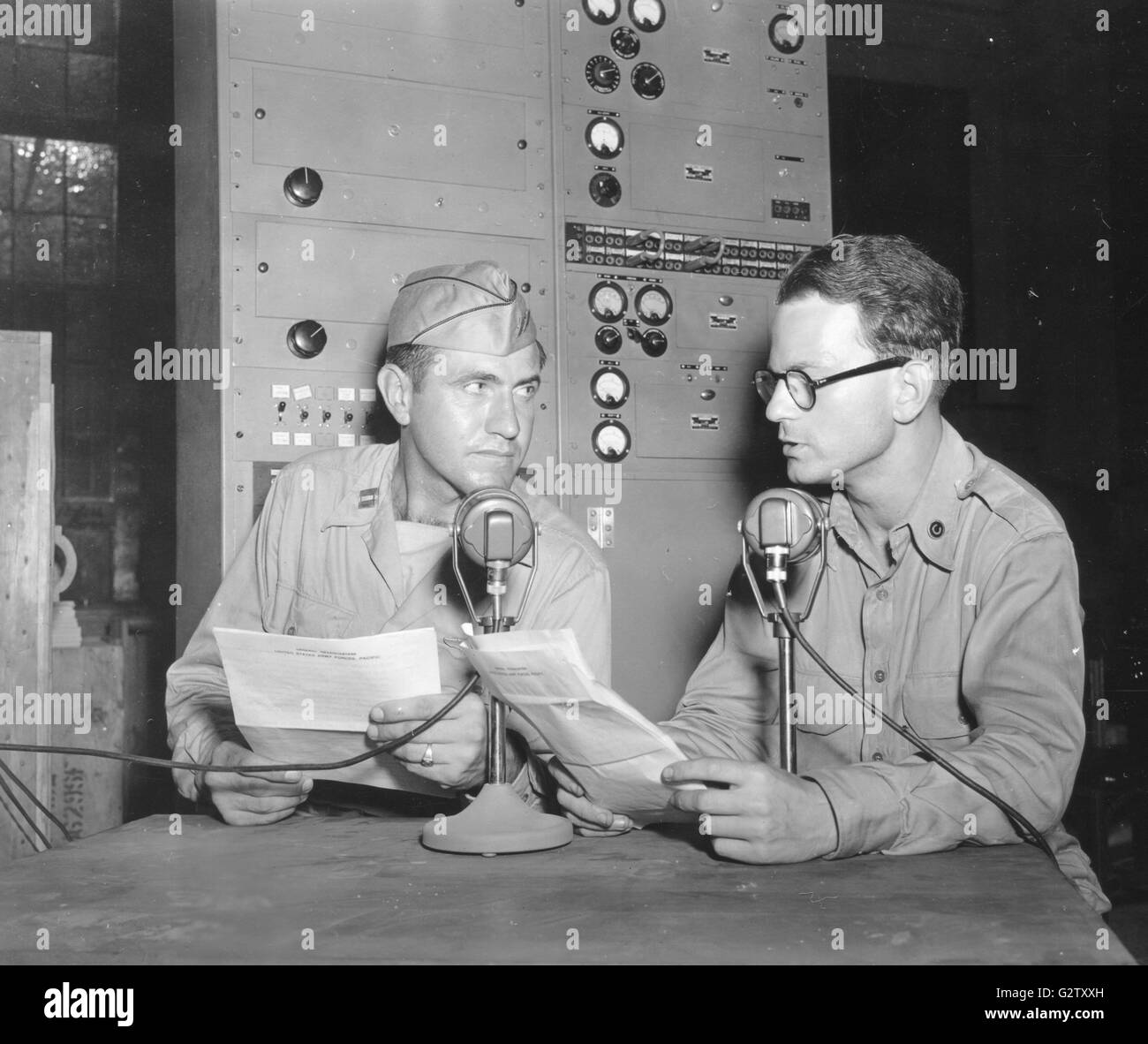 Capt Louis Zamperini of Los Angeles, CA, recently liberated after spending 28 months in a Japanese prison camp, makes a radio broadcast to the United States. Stock Photo
