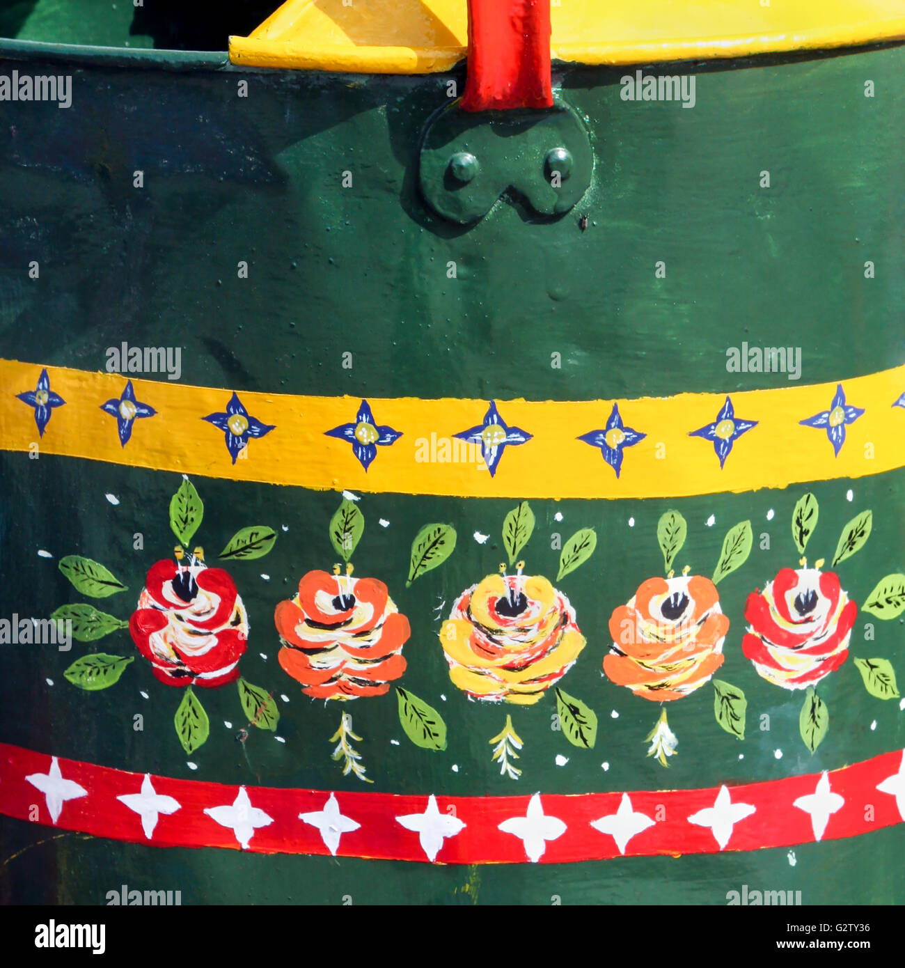 Wonderful canal folk art on the watering can of a British narrowboat Stock Photo