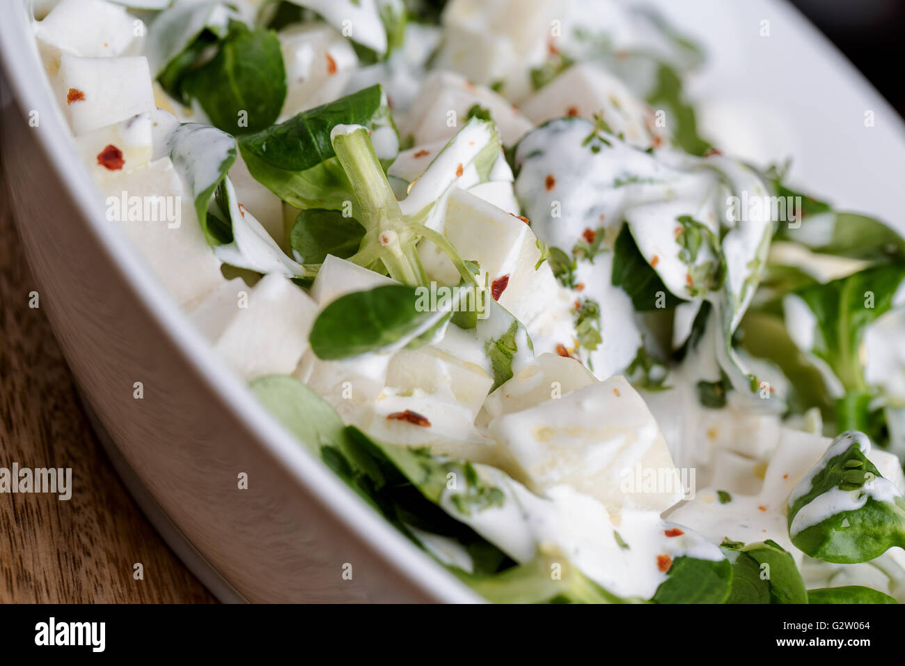 Fresh Salad of raw Kohlrabi with Yoghurt Stock Photo