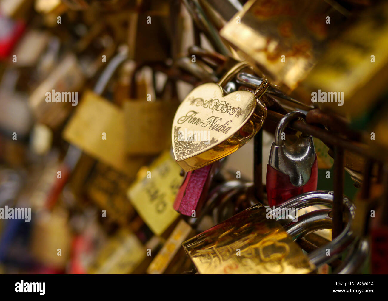A heart shaped lock on a bridge in Paris Stock Photo