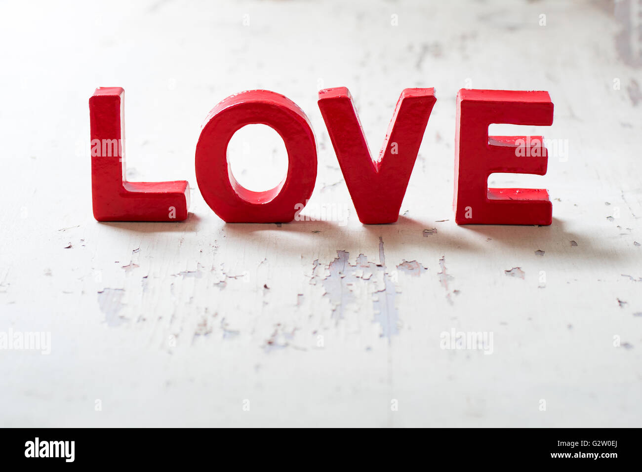 Letters love on wooden background Stock Photo