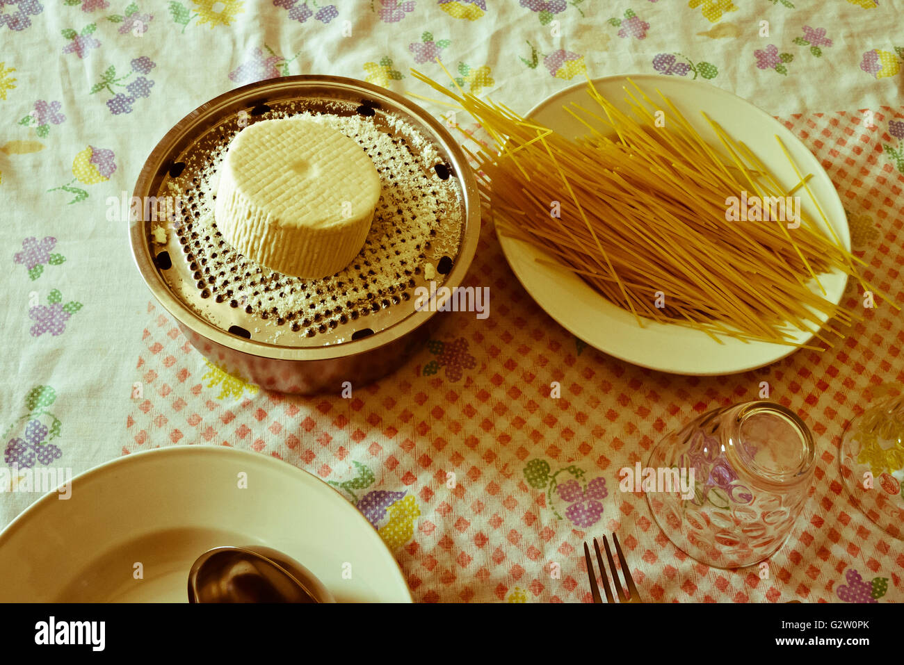 cheese,spaghetti and utensils. Stock Photo