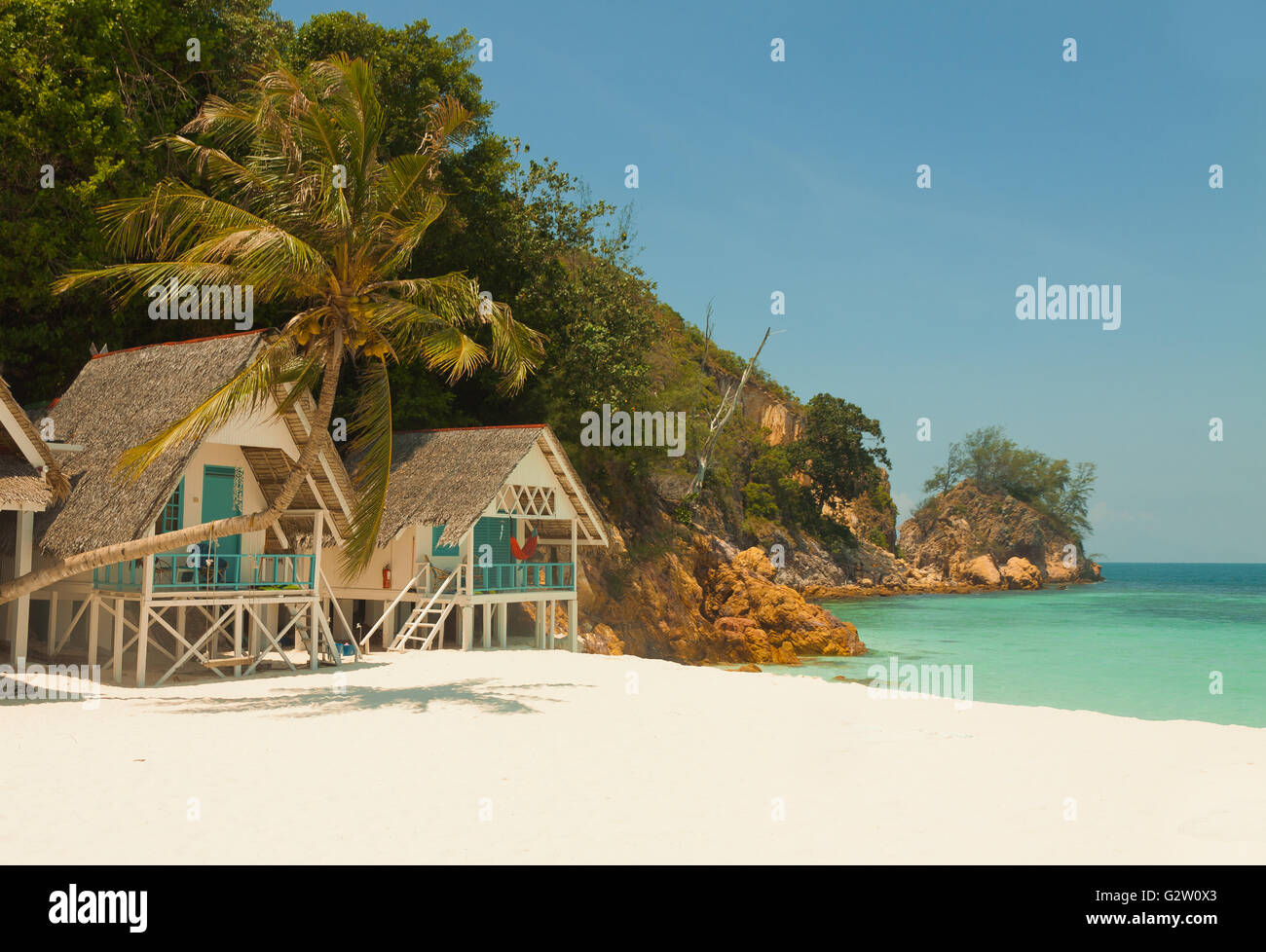Incredible landscape of little tropical island beach with nice Bungalow and perfect sky Stock Photo