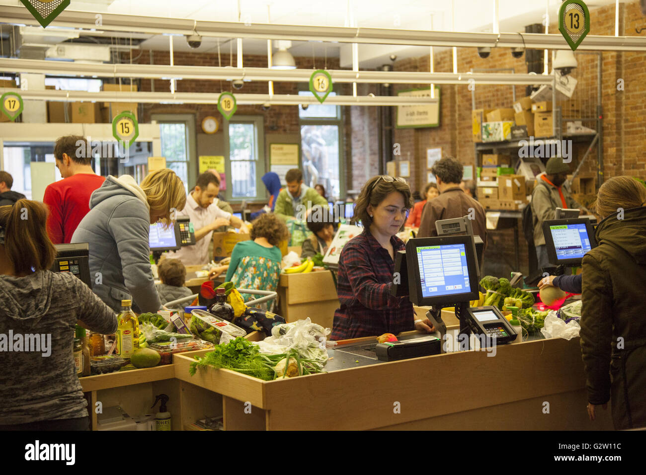 The checkout counters at the Park Slope Food Coop iis always busy due to its fresh produce, good