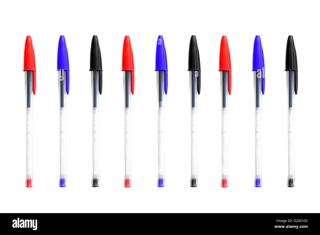 Red, Black and Blue pens photographed against a white background. Stock Photo