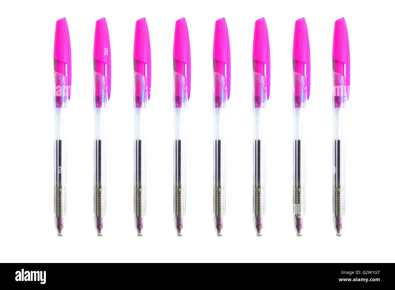 Pink biro pens photographed against a white background. Stock Photo