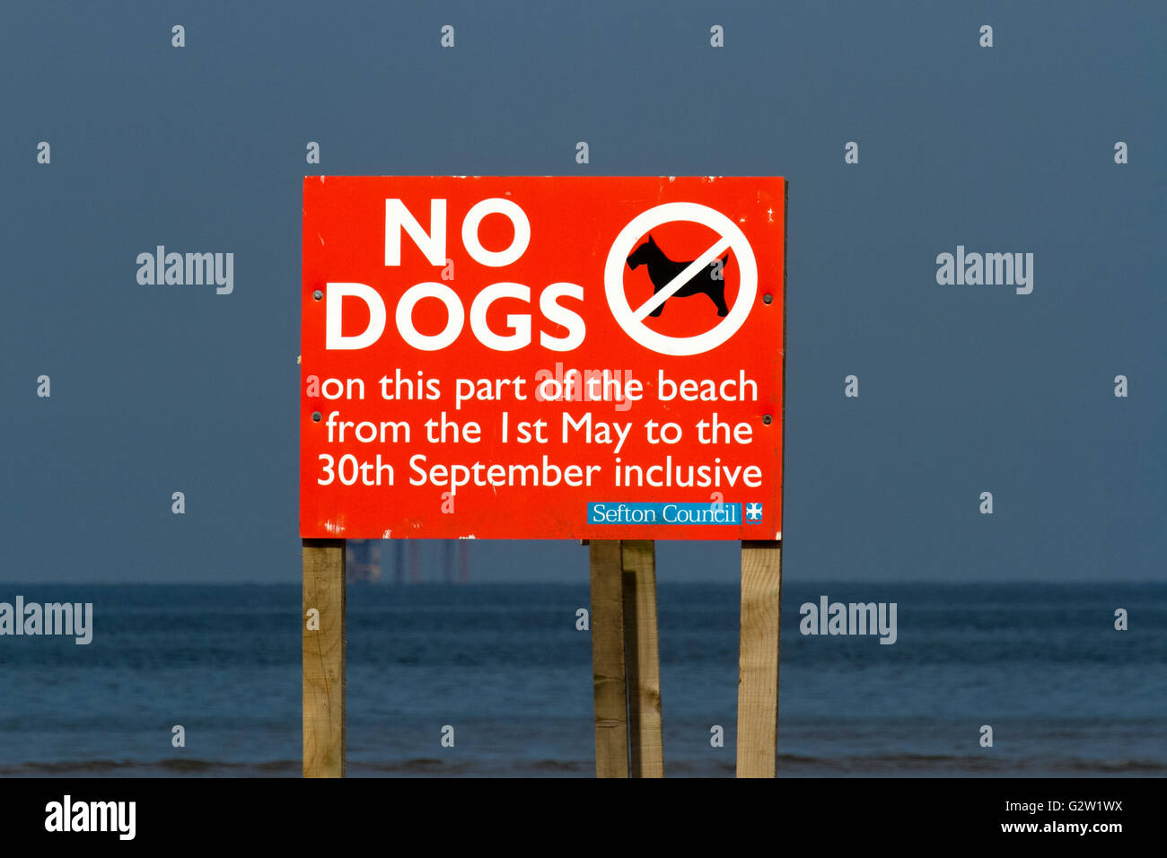 Seasonal restrictions for blue flag bathing, on this part of the beach,  in Southport, Meseyside, UK Stock Photo