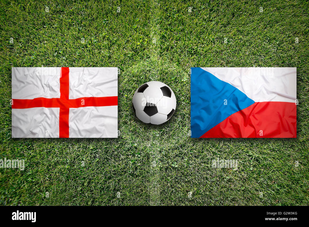 England vs. Czech Republic flags on a green soccer field Stock Photo