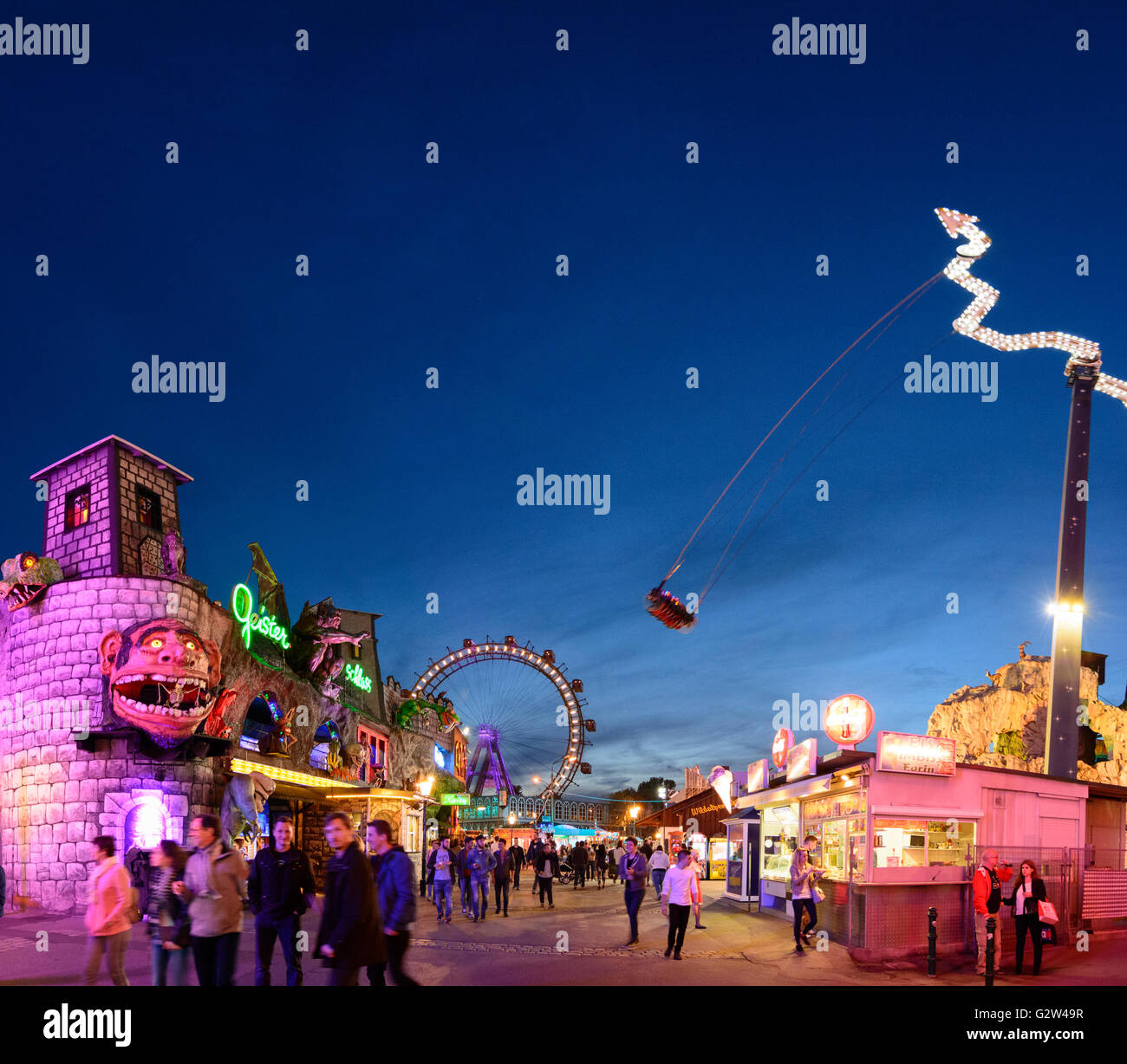 Prater with haunted castle , Ferris wheel and swing " Tornado ", Austria, Vienna, Wien Stock Photo