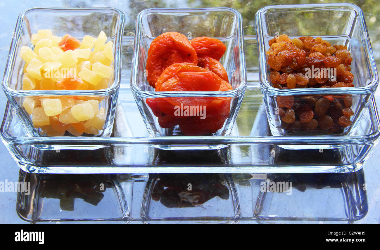 bright dried fruits in a transparent container Stock Photo Alamy