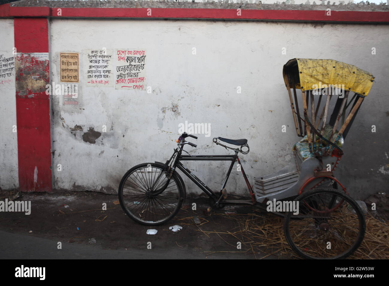 cycle rickshaws are still common in kolkata,which happens to be one of the four metro cities of india Stock Photo