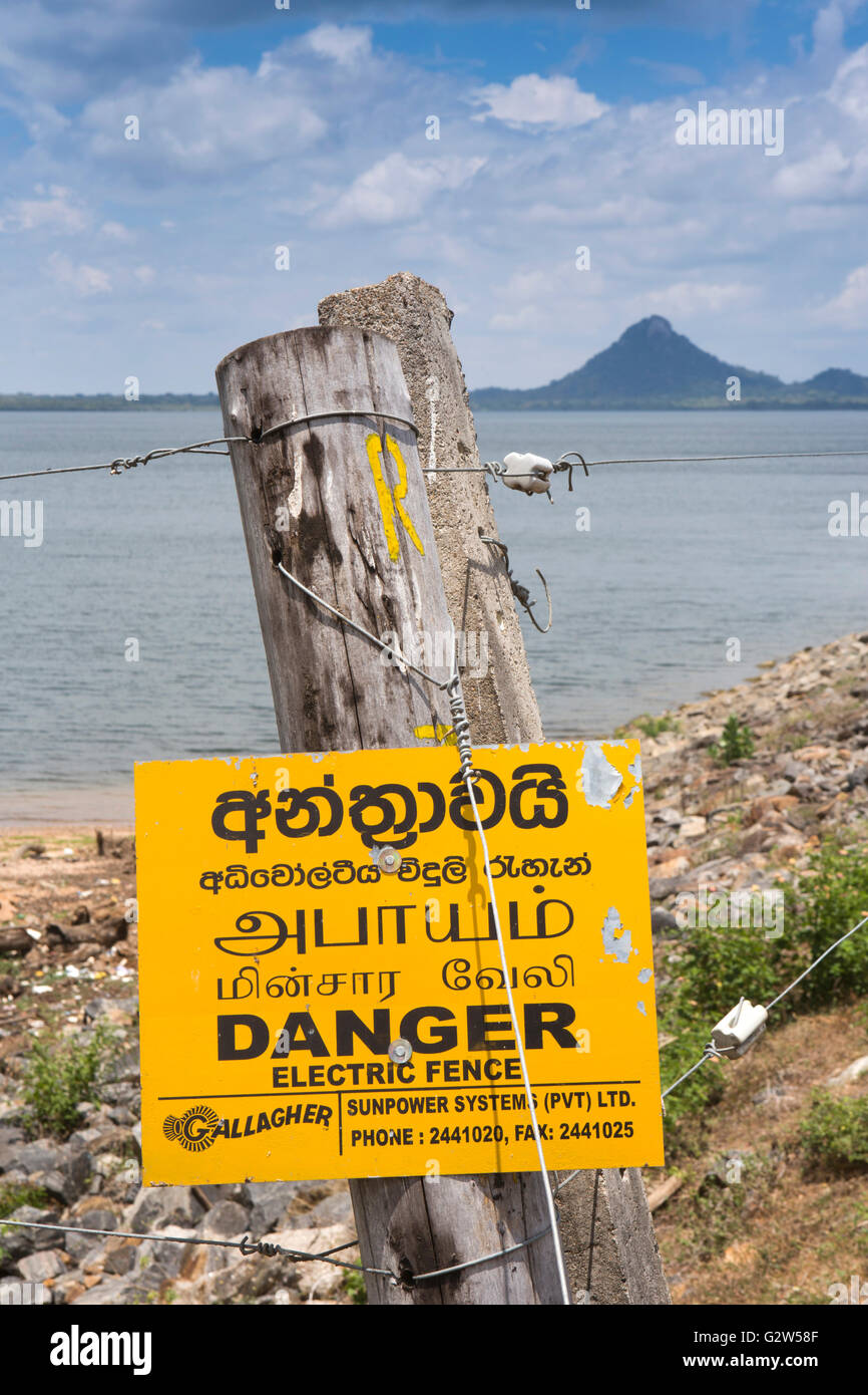 Sri Lanka, Lunugamvehera National Park, electric fence guarding Lugumvahera Reservoir, against elephants Stock Photo