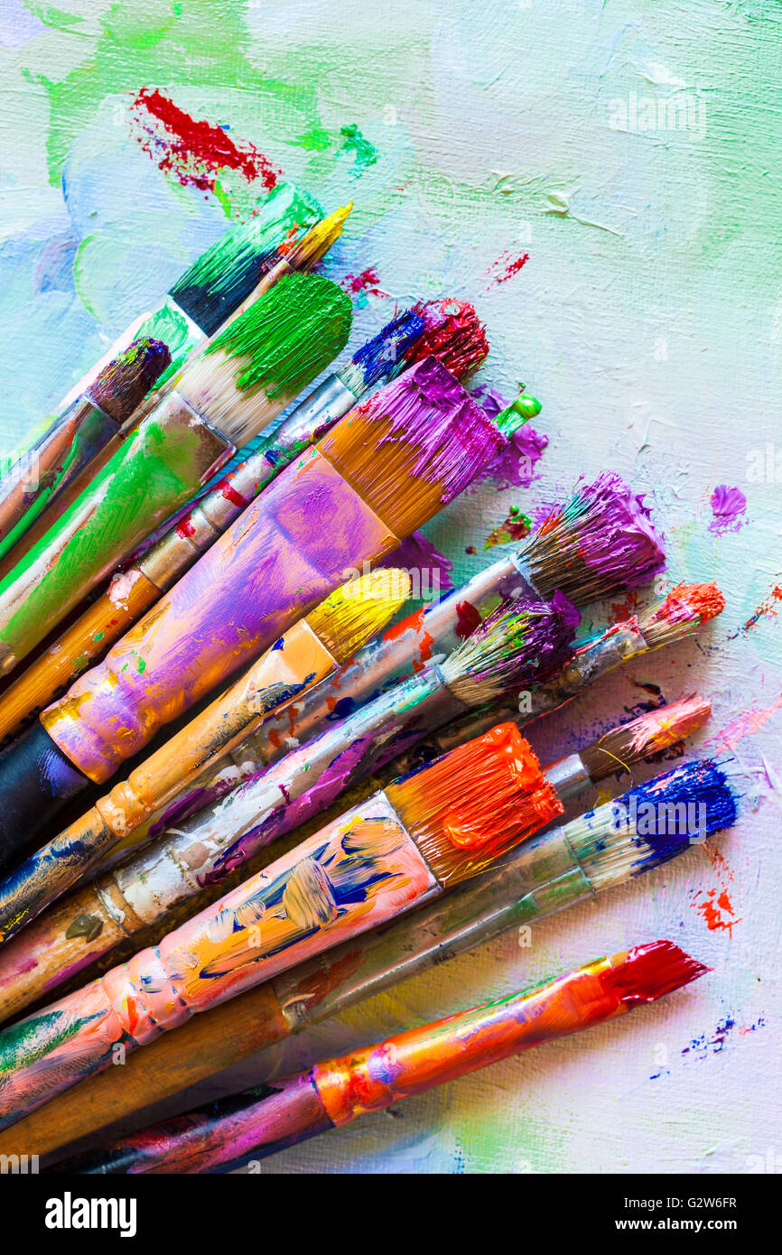 Bunch of artist paintbrushes closeup on canvas Stock Photo - Alamy