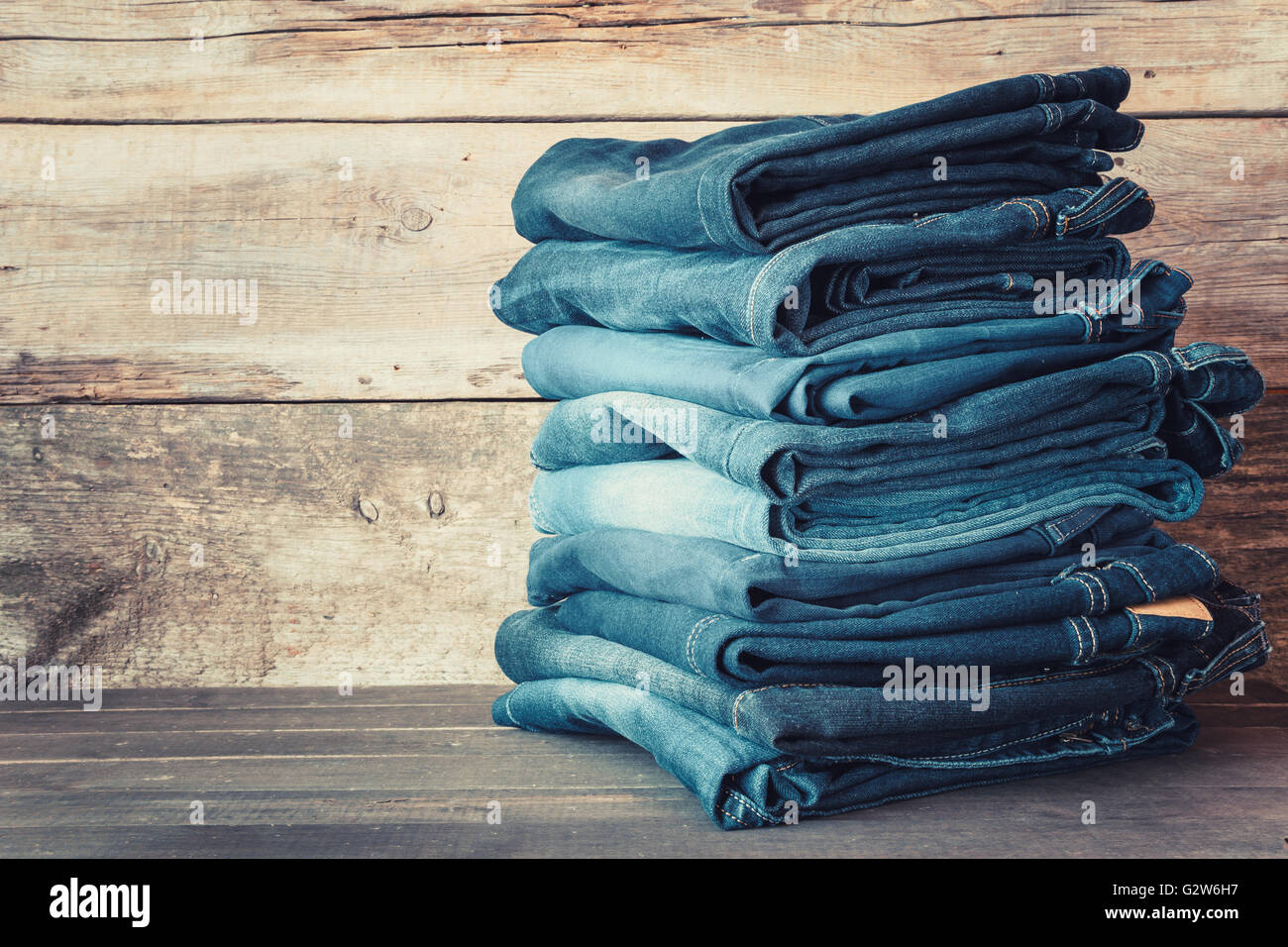 Stacked fashion blue jeans in store Stock Photo