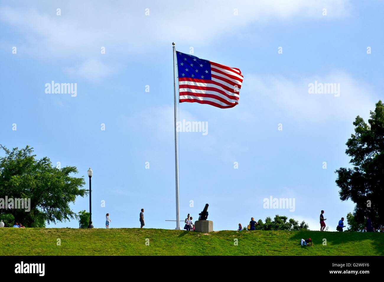 A United States flag stands tall on federal hill park near the
