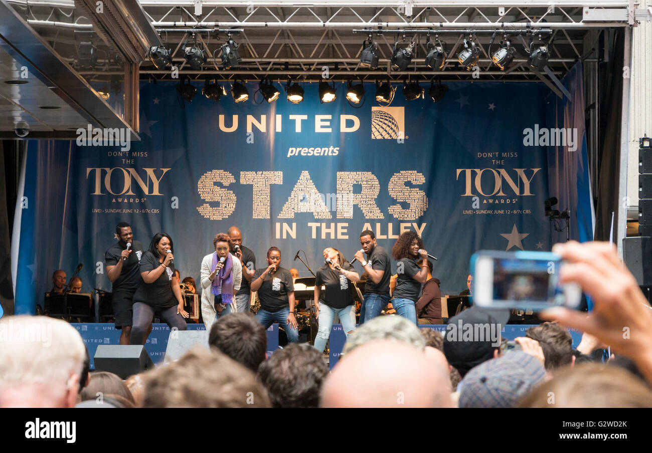 The cast of The Colour Purple Broadway production performing one of their songs at the free Stars in the Alley concert in Shubert Alley, New York. Stock Photo