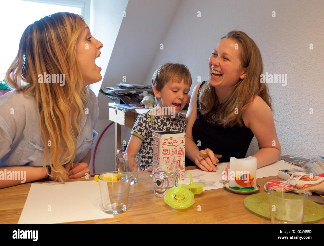 Katharina Frisch (R) sits with her four-year-old son Elija (C) and the ...
