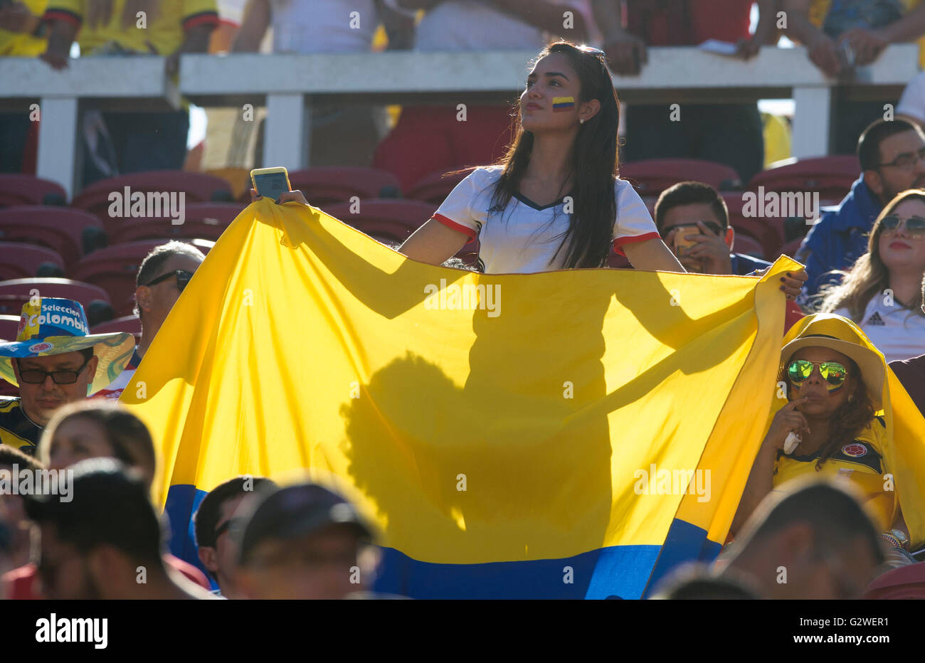 Santa Clara, USA. 3rd June, 2016. A woman waves the national flag of Colombia during the opening ceremony of Copa America Centenario games at the Levi's Stadium in Santa Clara, California, the United States, June 3, 2016. Credit:  Yang Lei/Xinhua/Alamy Live News Stock Photo