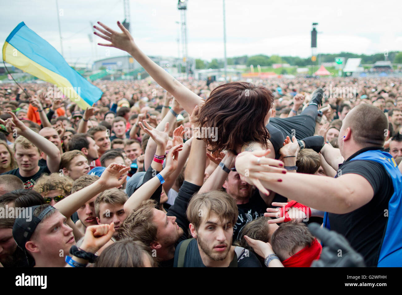 Nuremberg, Germany. 03rd June, 2016. A woman crowdsurfs during a concert at the music festival 'Rock im Park' (Rock in the Park) in Nuremberg, Germany, 03 June 2016. More than 80 bands are set to perform at the festival until 05 June. Photo: DANIEL KARMANN/dpa/Alamy Live News Stock Photo