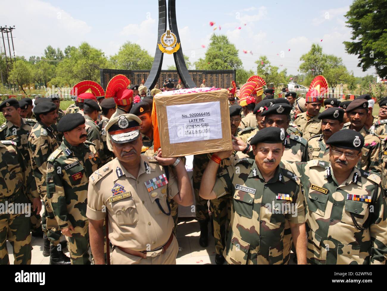 Srinagar, Indian-controlled Kashmir. 4th June, 2016. Officials of India's Border Security Force (BSF) carry the coffin of a slain border guard during a wreath laying ceremony at a BSF camp in the outskirts of Srinagar, summer capital of Indian-controlled Kashmir, June 4, 2016. The militant attack on convoy of India's Border Security Force (BSF) on Friday left three border guards dead and nine others wounded, two of them critically, in restive Indian-controlled Kashmir, officials said. Credit:  Javed Dar/Xinhua/Alamy Live News Stock Photo