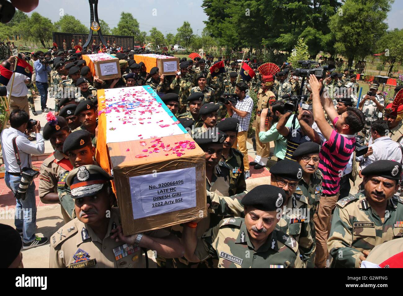 Srinagar, Indian-controlled Kashmir. 4th June, 2016. Officials of India's Border Security Force (BSF) carry coffins of slain border guards during a wreath laying ceremony at a BSF camp in the outskirts of Srinagar, summer capital of Indian-controlled Kashmir, June 4, 2016. The militant attack on convoy of India's Border Security Force (BSF) on Friday left three border guards dead and nine others wounded, two of them critically, in restive Indian-controlled Kashmir, officials said. Credit:  Javed Dar/Xinhua/Alamy Live News Stock Photo