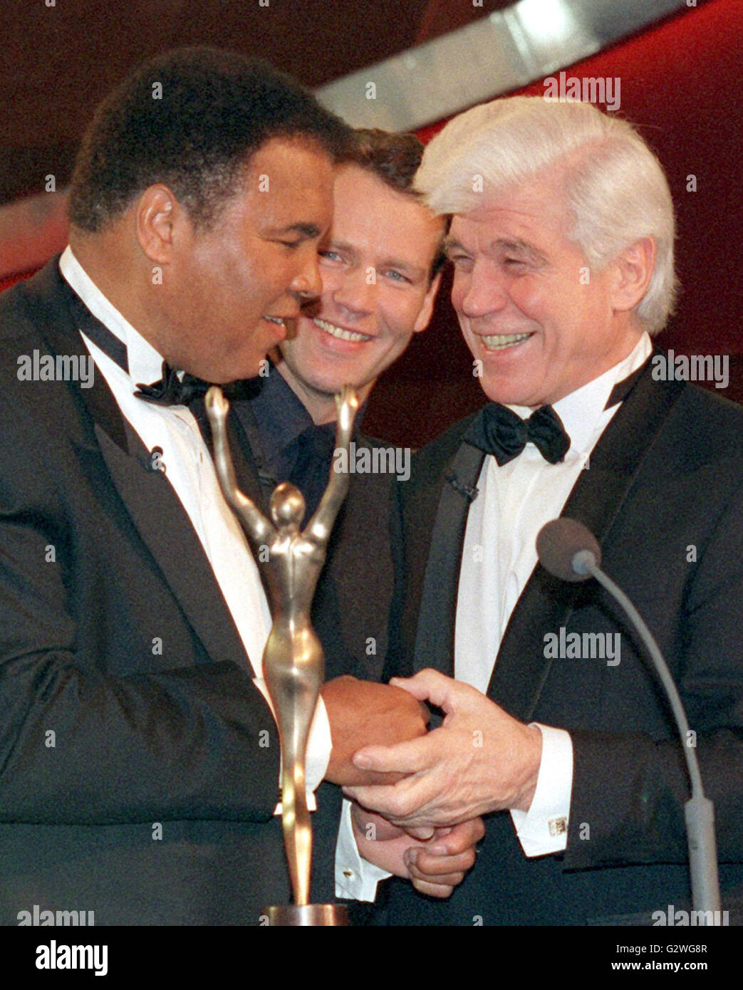 FILE - A file picture dated 16 December 1998 shows boxing legends (L-R) Muhammad Ali, Henry Maske and Karl Mildenberger during the recording of the 'Deutschlands Sportler des Jahres 1998' (lit. Germany's athletes of the year 1998) show by German public broadcaster ARD in Munich, Germany. Born Cassius Clay, boxing legend Muhammad Ali, dubbed 'The Greatest, ' died on 03 June 2016 in Phoenix, Arizona, USA, at the age of 74, a family spokesman said. Photo: URSULA DUEREN/dpa Stock Photo