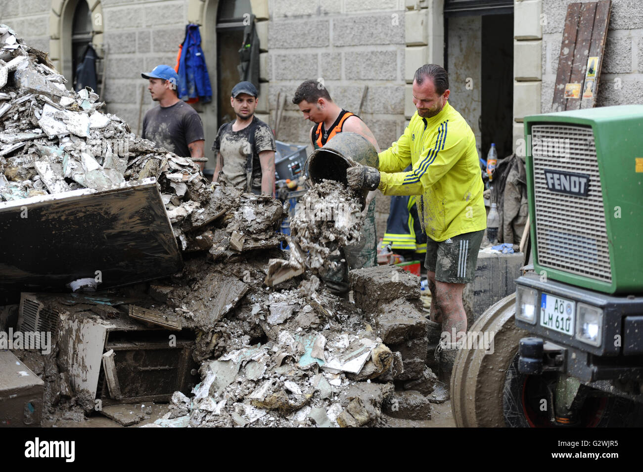 Bavaria, Germany. 04th June, 2016. Helpers tip rubble onto a pile