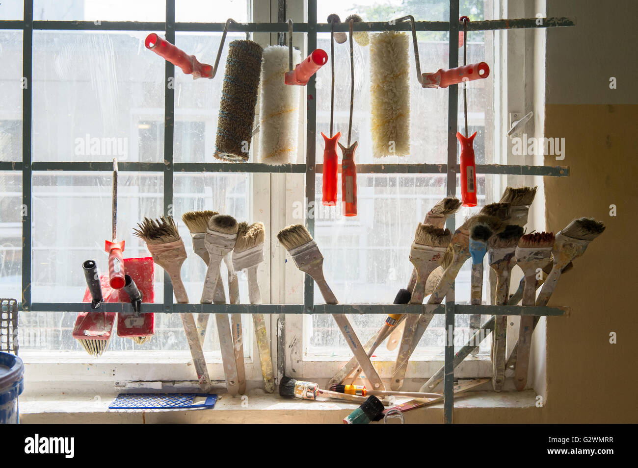 Berlin, Germany, paint rollers, brushes and tassels in a painting workshop Stock Photo